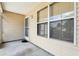 Enclosed patio space with neutral siding, providing a serene outdoor area at 17097 Se 96Th Chapelwood Cir, The Villages, FL 32162