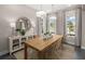 Bright dining room featuring a wooden table, stylish chairs, and elegant decor at 1969 Beach Ter, Celebration, FL 34747