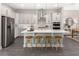 Beautiful eat-in kitchen with a large center island, stainless steel appliances, and bar stool seating at 1969 Beach Ter, Celebration, FL 34747