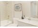 Clean bathroom featuring a shower-tub combo, single vanity, and modern fixtures and fittings at 1993 Beach Ter, Celebration, FL 34747