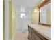 Bathroom with a double sink vanity and tiled shower and floors at 202 Riverview Dr, Longwood, FL 32779