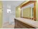 This bathroom features double sinks and a white tiled shower at 202 Riverview Dr, Longwood, FL 32779