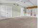 This spacious bedroom has light green walls and a ceiling fan at 202 Riverview Dr, Longwood, FL 32779