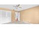 Empty bedroom with neutral carpet, ceiling fan, and closet at 202 Riverview Dr, Longwood, FL 32779