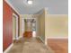 Bright entryway with tiled floors, leading into rooms with hardwood floors at 202 Riverview Dr, Longwood, FL 32779
