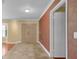 The foyer features tiled floors and textured wallpaper at 202 Riverview Dr, Longwood, FL 32779