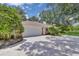 Home exterior showcases a spacious three-car garage and expansive driveway, providing ample parking space at 202 Riverview Dr, Longwood, FL 32779