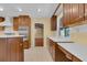 Spacious kitchen featuring wood cabinets, stainless steel appliances, and white countertops at 202 Riverview Dr, Longwood, FL 32779