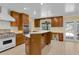 Well-equipped kitchen features a breakfast bar, stainless steel appliances, and seamless access to outdoor area at 202 Riverview Dr, Longwood, FL 32779