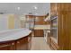 Gourmet kitchen features stainless steel appliances, custom cabinets, and a spacious island for entertaining at 202 Riverview Dr, Longwood, FL 32779
