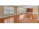 Large living room showcasing hardwood floors and bright light, perfect for relaxing and entertaining at 202 Riverview Dr, Longwood, FL 32779