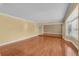 Spacious living room featuring hardwood floors, crown molding, and large windows at 202 Riverview Dr, Longwood, FL 32779