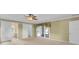 Primary bedroom boasting barn doors to bathroom and doors to the exterior at 202 Riverview Dr, Longwood, FL 32779