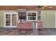 Outdoor kitchen featuring a built-in grill, refrigerator, and sink, perfect for entertaining and al fresco dining at 202 Riverview Dr, Longwood, FL 32779