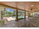 Covered lanai featuring a swimming pool, brick columns, and tiled flooring with ceiling fans at 202 Riverview Dr, Longwood, FL 32779