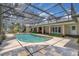Screened in pool area with patio space and seating around the pool at 202 Riverview Dr, Longwood, FL 32779