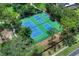 Aerial view of tennis and pickleball courts, nestled within lush greenery and offering a great recreational area at 202 Riverview Dr, Longwood, FL 32779
