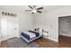 Cozy bedroom featuring wood floors, ceiling fan, and stylish decor with a personalized 'Jason' sign at 20796 Quinn St, Orlando, FL 32833