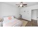 Bright, cheerful bedroom featuring hardwood floors, ceiling fan, and pastel decor at 20796 Quinn St, Orlando, FL 32833