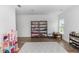 Large, bright bonus room with hardwood floors, ample shelving, and large windows at 20796 Quinn St, Orlando, FL 32833