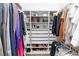 Spacious walk-in closet with custom shelving and rods for optimal organization and storage at 20796 Quinn St, Orlando, FL 32833