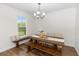 Comfortable dining area with a wooden table, upholstered chairs, and natural lighting at 20796 Quinn St, Orlando, FL 32833