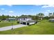 Stunning two-story home featuring a spacious driveway, lush green lawn, and a basketball court at 20796 Quinn St, Orlando, FL 32833