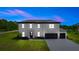 Striking two-story home boasting a three-car garage and manicured front lawn at 20796 Quinn St, Orlando, FL 32833