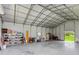 Spacious metal building ready for use as a garage or workshop with a high ceiling and large door at 20796 Quinn St, Orlando, FL 32833