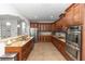 Spacious kitchen with stainless steel appliances, granite countertops, and wood cabinetry at 20796 Quinn St, Orlando, FL 32833