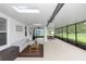 Extended, screened-in lanai offers multiple seating areas and views of the backyard at 20796 Quinn St, Orlando, FL 32833