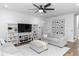 Bright living room with modern furniture, built-in shelving, and stylish decor at 20796 Quinn St, Orlando, FL 32833