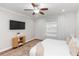 Light filled bedroom with ceiling fan, neutral decor, and large window at 20796 Quinn St, Orlando, FL 32833