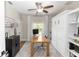 Office featuring a large desk, stylish decor, and a murphy bed hidden behind white cabinets at 20796 Quinn St, Orlando, FL 32833