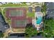 Aerial view of community tennis and pool area with nearby condos and walking paths at 2206 Stonington Ave # 2206, Orlando, FL 32817