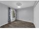 Bedroom with gray walls, laminate floors, a window, and a closet for storage at 2206 Stonington Ave # 2206, Orlando, FL 32817