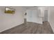 Bedroom with gray wood floors, a mounted TV, and a closet for storage at 2206 Stonington Ave # 2206, Orlando, FL 32817