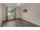 Bedroom with a ceiling fan, a mounted TV, and a view of the yard from the window at 2206 Stonington Ave # 2206, Orlando, FL 32817