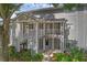 Inviting exterior view of condo featuring gray siding, stairs, and a small balcony at 2206 Stonington Ave # 2206, Orlando, FL 32817