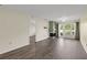 Living room with a decorative fireplace, neutral walls, and views from the large glass windows at 2206 Stonington Ave # 2206, Orlando, FL 32817