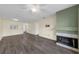 Inviting living room with a fireplace, neutral paint, and modern ceiling fan at 2206 Stonington Ave # 2206, Orlando, FL 32817