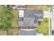 Aerial view of the home featuring lush lawn, patio, and mature trees at 2216 Grand Tree Ct, Lake Mary, FL 32746