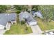 A high angle view of the house with lush green lawn and landscaped front yard at 2216 Grand Tree Ct, Lake Mary, FL 32746