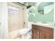 Charming bathroom with decorative mirror, shelves, and a shower tub with curtain at 2216 Grand Tree Ct, Lake Mary, FL 32746