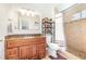Bathroom featuring a granite vanity with a tiled shower and updated fixtures at 2216 Grand Tree Ct, Lake Mary, FL 32746