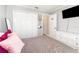 Cozy bedroom features a built-in closet for storage and a sleek, modern dresser at 2216 Grand Tree Ct, Lake Mary, FL 32746
