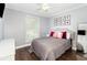 Cozy bedroom with hardwood floors, large window, and stylish decor at 2216 Grand Tree Ct, Lake Mary, FL 32746