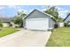 Exterior shot of the home highlighting the two-car garage at 2216 Grand Tree Ct, Lake Mary, FL 32746