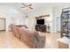 Inviting living room boasts a large television, tile flooring, and vaulted ceilings at 2216 Grand Tree Ct, Lake Mary, FL 32746