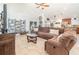 Comfortable living room showcasing the tile floor plan, vaulted ceilings, and slider door to the patio at 2216 Grand Tree Ct, Lake Mary, FL 32746